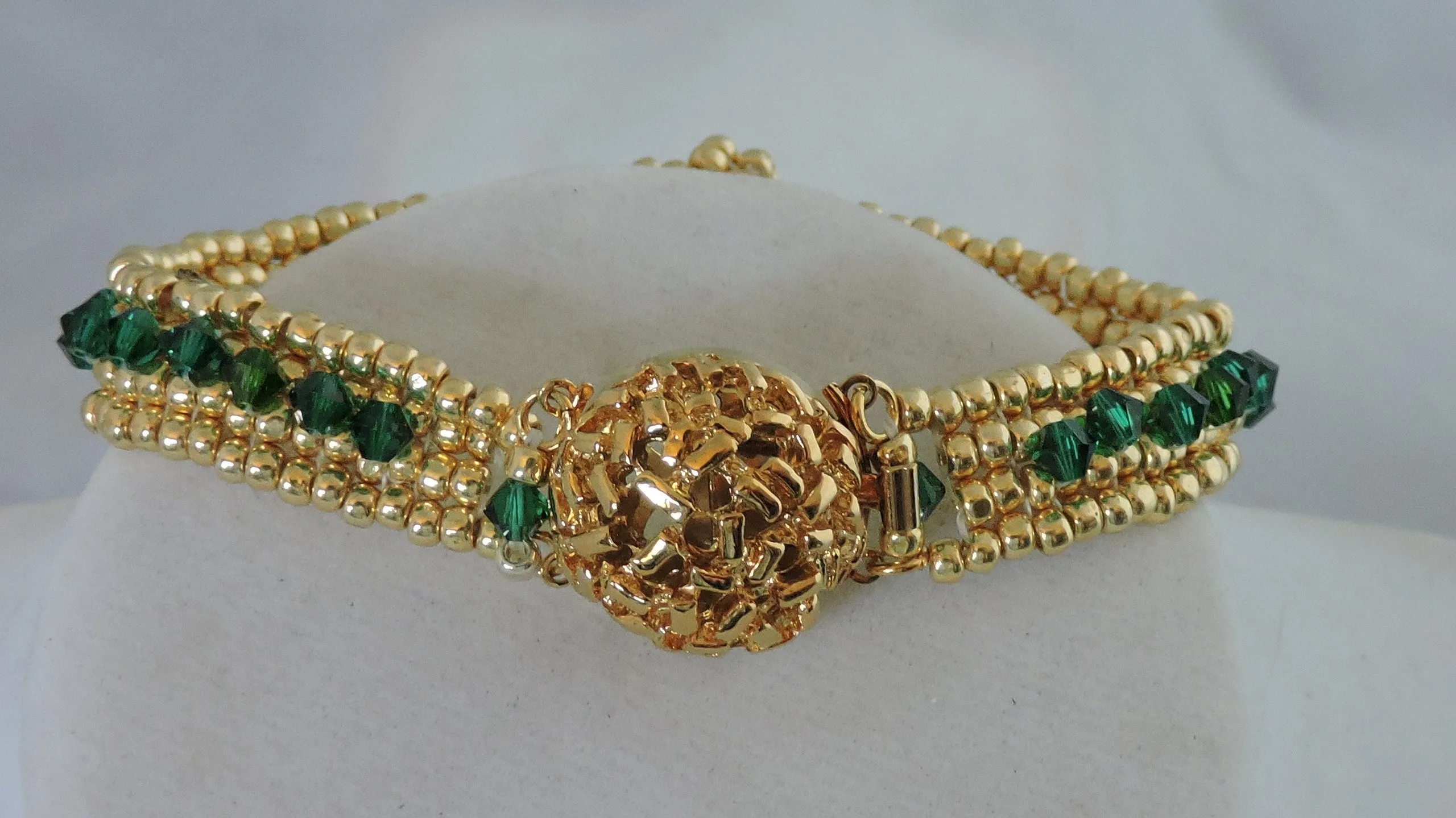 Bracelet with Swarovski Emerald Bicones and Gold Beads